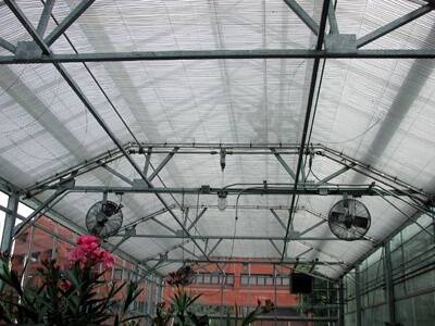 Photo of greenhouse with thermal curtains closed.