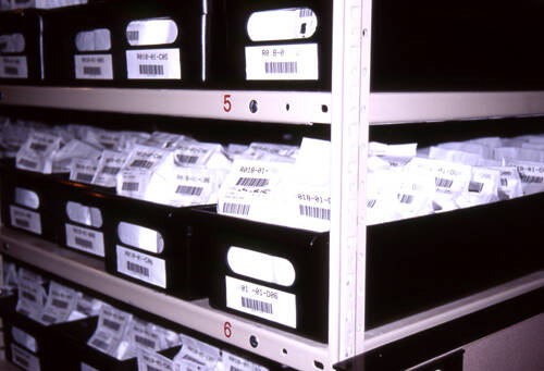 Photo showing packages of seeds stored in containers