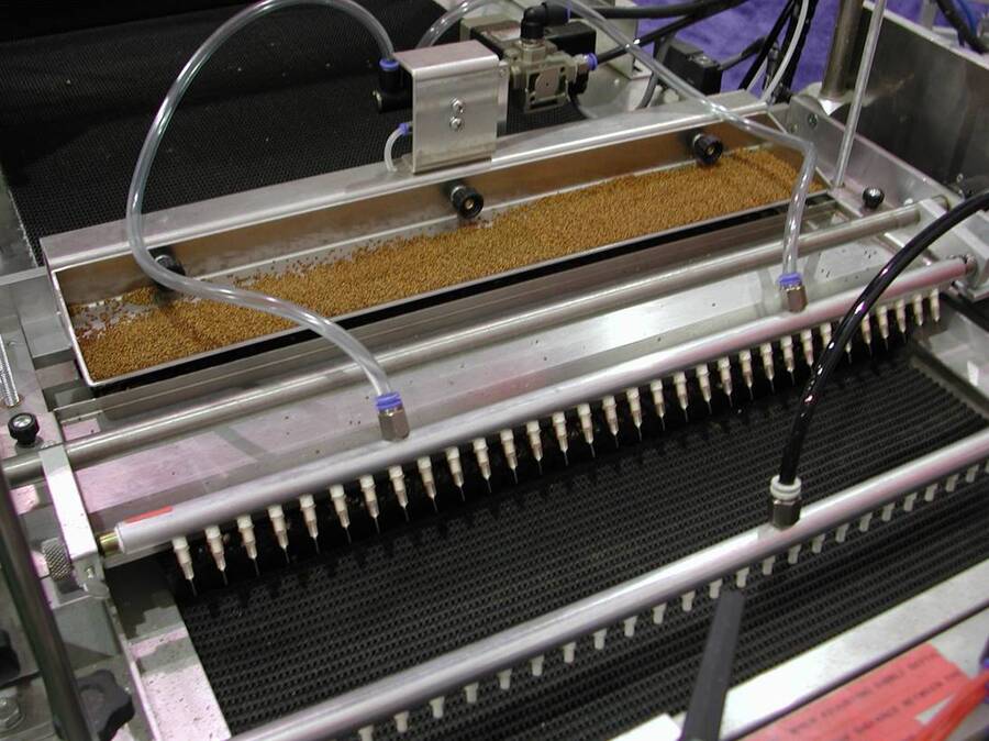 Photo of a needle seeder machine.