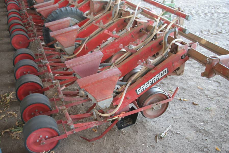 Photo of a mechanical field seeder.