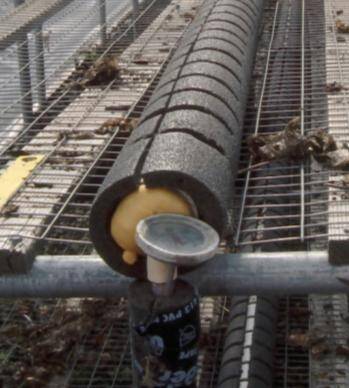 Photo of a hot-pipe system showing a heating pipe wrapped with insulation.