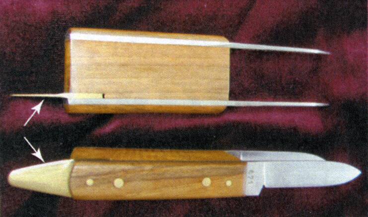 Photo showing a tool with two parallel knif blades to create consistently sized cuts for patch budding. 